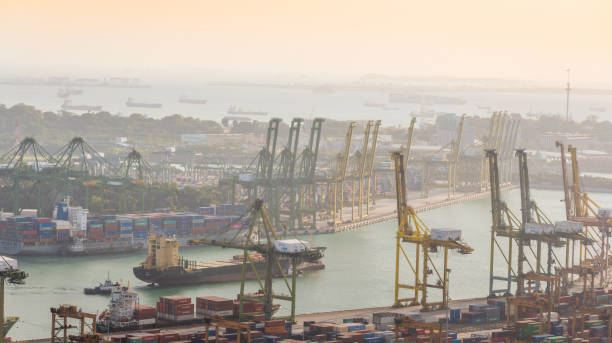 istock Container Cargo freight ship with working crane bridge in shipyard in singapore 928790488