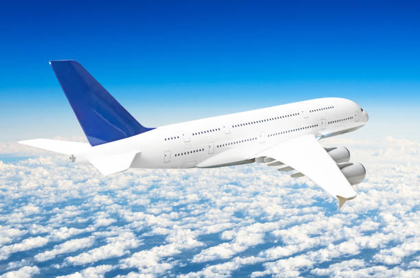 istock Passenger huge liner airplane fly above clouds and blue sky. 928790698