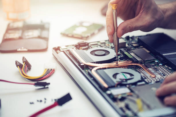 technician repairing laptop computer closeup technician repairing laptop computer closeup repairing stock pictures, royalty-free photos & images