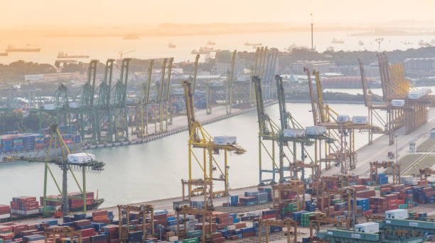 istock Container Cargo freight ship with working crane bridge in shipyard in singapore 928791446