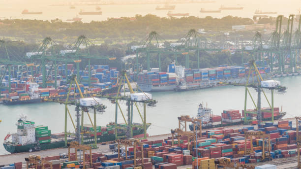 istock Container Cargo freight ship with working crane bridge in shipyard in singapore 928791478