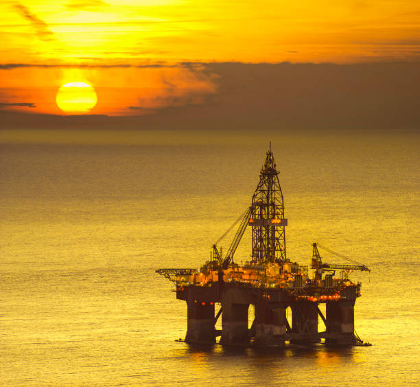 istock drilling platform on the sea at sunrise 928791726