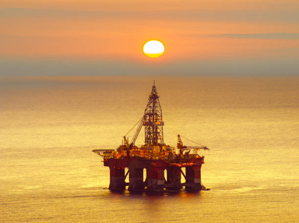 istock drilling platform on the sea at sunrise 928792068