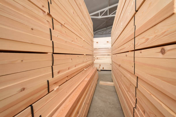 istock Many folded wooden planks in a warehouse 928792072