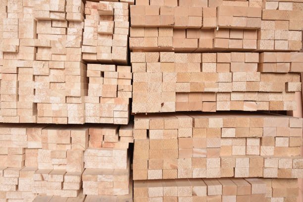 istock Texture of folded wooden planks in a warehouse with a forest. 928792138