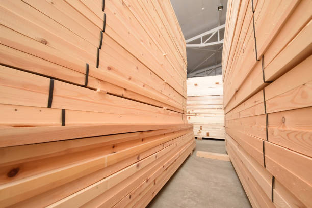 istock Many folded wooden planks in a warehouse 928792160