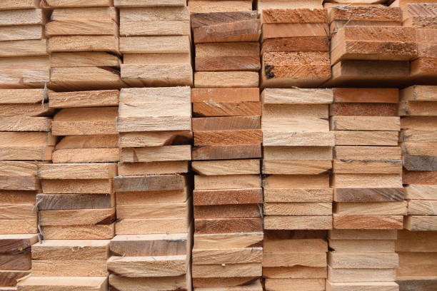 istock Texture of folded wooden planks in a warehouse with a forest. 928794326