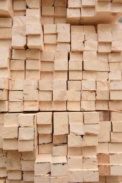 istock Texture of folded wooden planks in a warehouse with a forest. 928794448