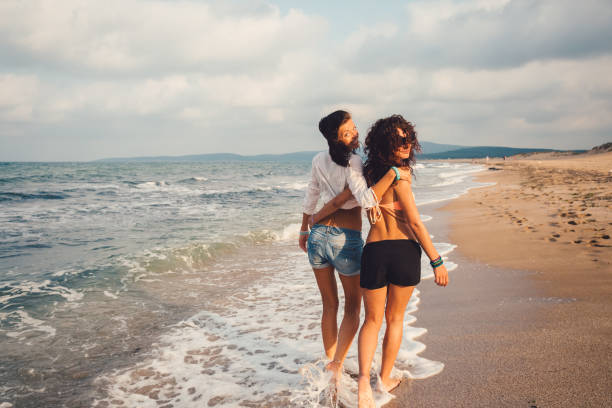 istock Happy girls at the beach 928797918