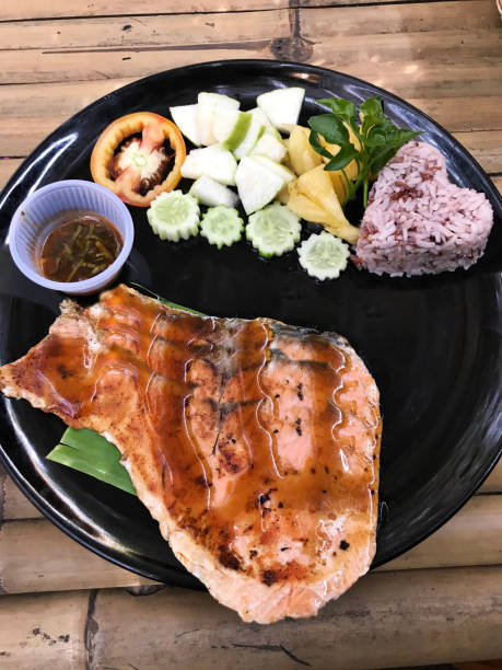 Salmon steak set served with brown rice.