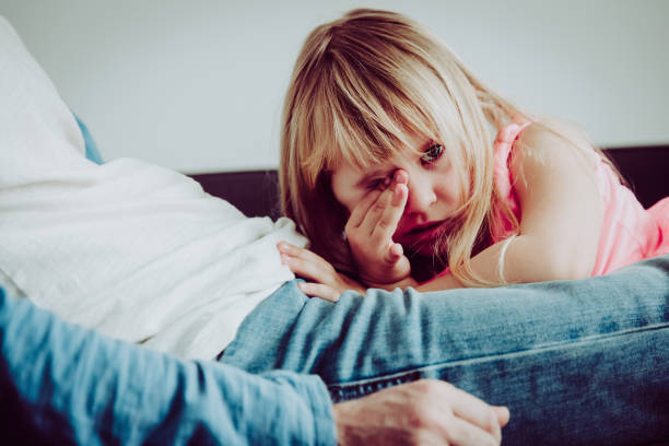 istock crying child with dad at home, sorrow, pain, depression 928802512