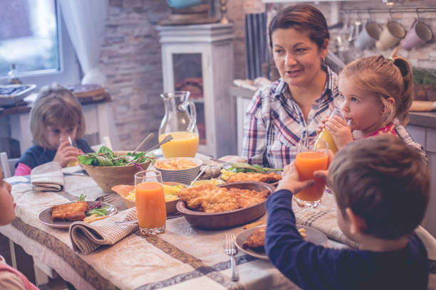 istock Eating Wiener Schnitzel with Potatoes and Green Salad 928802762