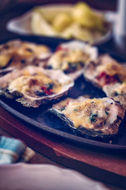 Baked Oysters Served on Plate Baked Oysters Served on Plate 11189 stock pictures, royalty-free photos & images