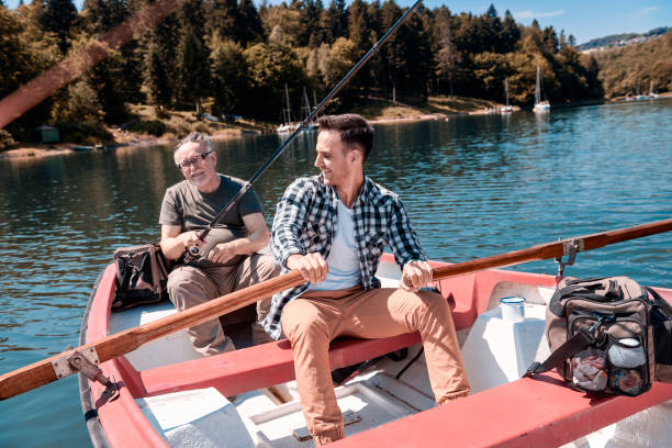 istock Two men spending time together on the lake 928807968