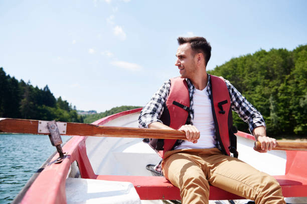 istock Men paddling and admiring the view 928808772