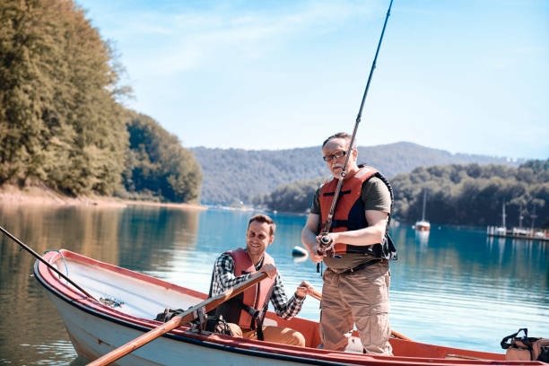 istock Son and father bonding during fishing on jetty 928809150