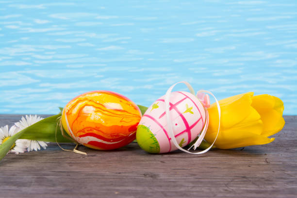 istock Easter in pool, wellness and relax. Eggs and water background for party and spa 928809164