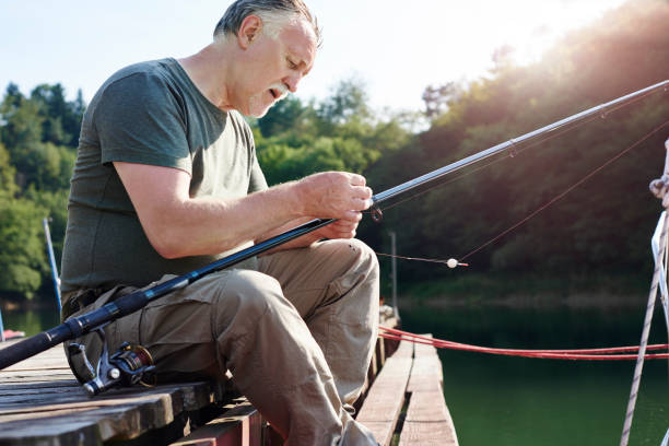 istock Senior men make preparations for fishing 928810924