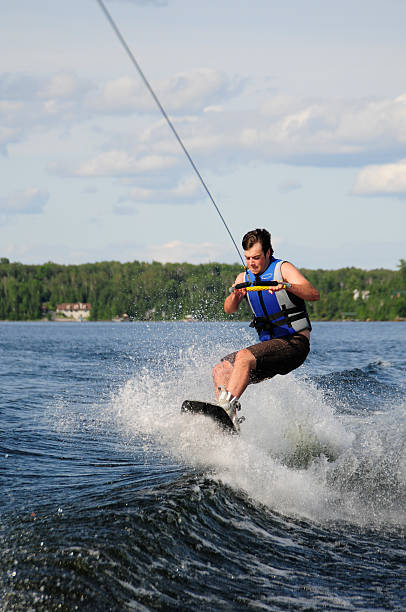 istock Young man wakeboarding concentrates hard looking intense. 92881416