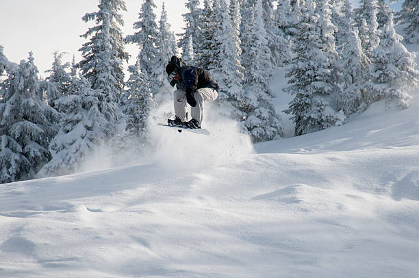 istock Snowboarder jumps above fresh powder snow. 92881424