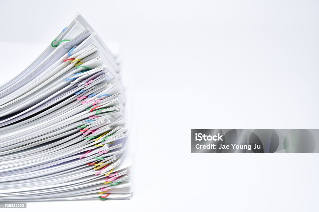 A pile of documents with copy space on white background. Paper Stock Photo