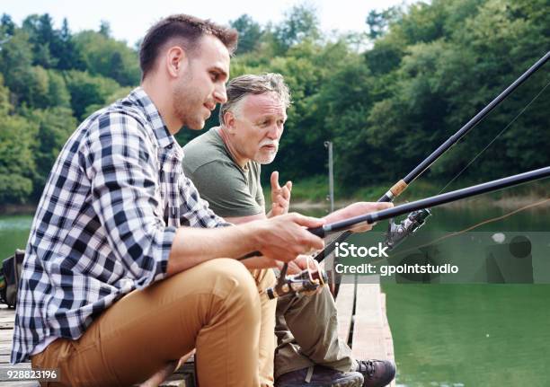 Men Talking And Fishing Together Stock Photo - Download Image Now - Fishing Industry, Fishing, Son