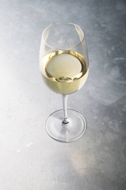istock Glass of white wine on a bar counter 928823404
