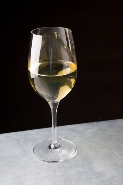 istock Glass of white wine on a bar counter 928823572