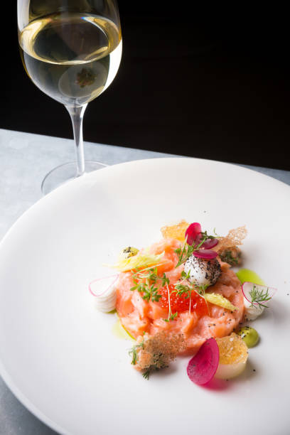 istock Raw salmon salad with herbs 928823962