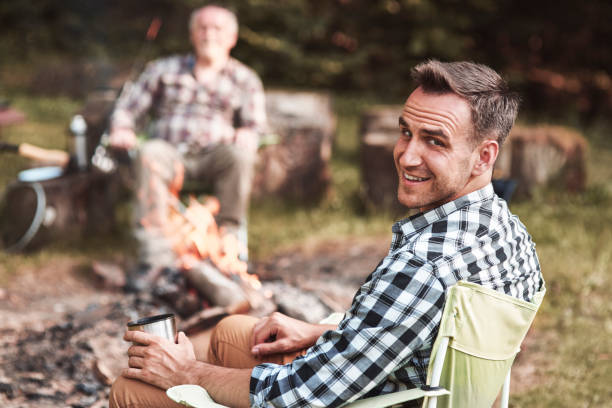 istock Man sitting in his chair in forest 928826068