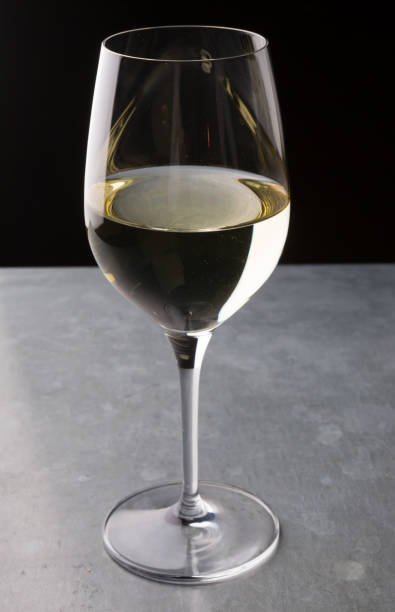 istock Glass of white wine on a bar counter 928827316