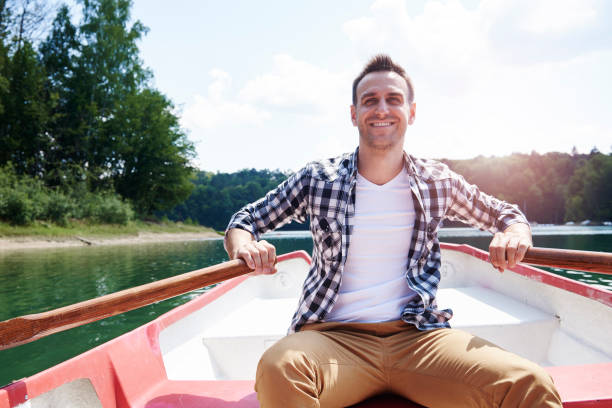 Portrait of cheerful men paddling