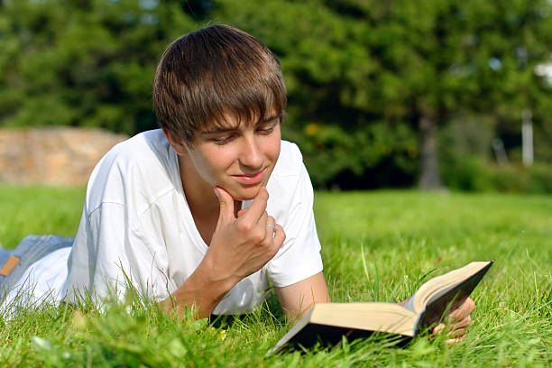 istock teenager reads book 92882915