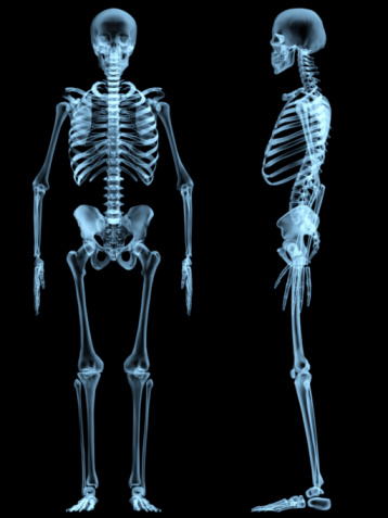 Skeleton of a man isolated on black background.