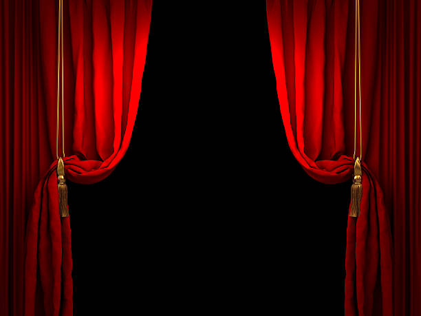 Red stage curtain drawn back with golden ropes stock photo