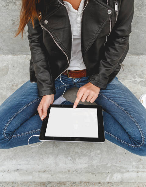 istock Girl with a tablet in hands 928836034