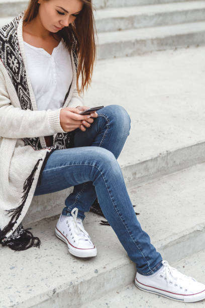 istock Girl with a phone in hands 928837018
