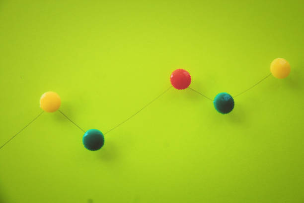 istock Colorful push pin on green paper. 928843888