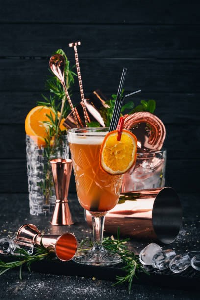 istock Alcohol Cocktail Mai Thai. On a black wooden background. 928843964