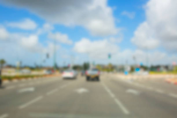 istock Abstract blurred background. Blurred road with car running 928845214