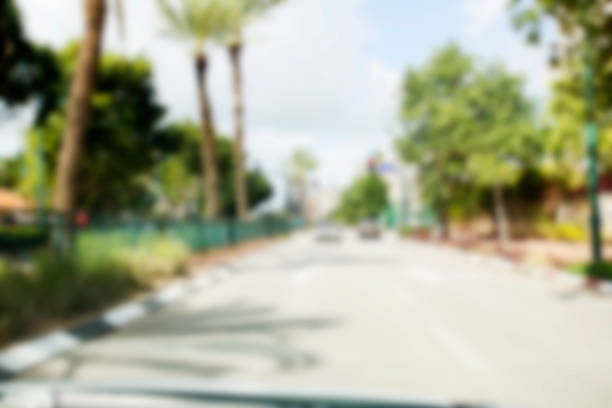istock Abstract blurred background. Blurred road with car running 928848522