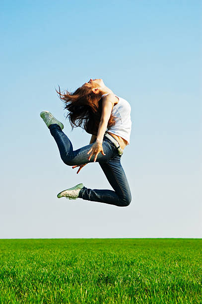 istock young woman in gymnastic jump 92884918
