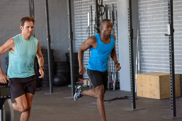 istock Two men running sprints in gym 928849444