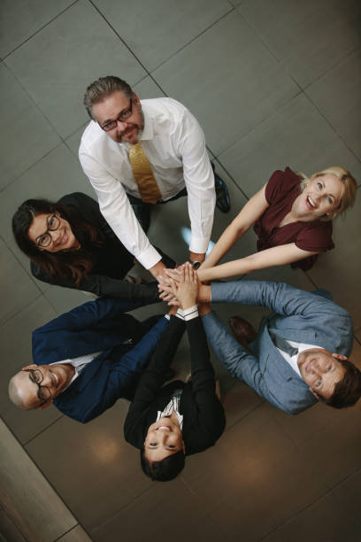 istock Business team hands stacked together 928849864