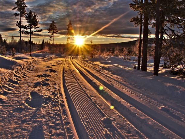 sunbeams on ski run stock photo