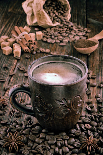 istock clay cup with coffee on the background of grains 928850716