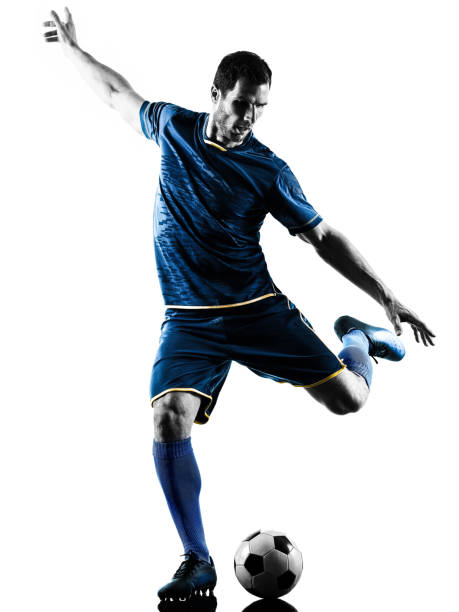istock soccer player man kicking silhouette isolated 928861988