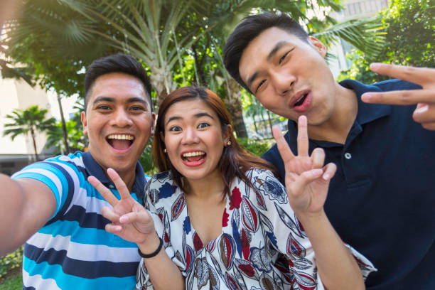 istock Playful selfie with friends 928866824