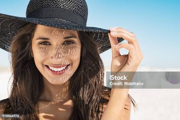 Woman Wearing Black Hat At Beach Stock Photo - Download Image Now - Women, One Woman Only, Sunlight