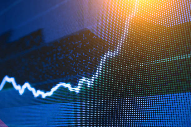 istock stock chart trend line in big LED screen 928867212